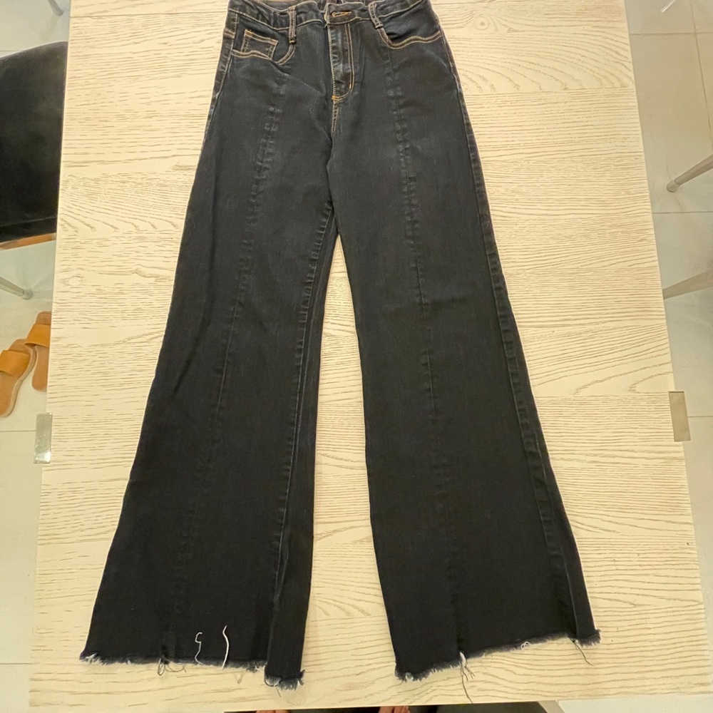 Valija High Rise Flared Legs Denim Pants.
